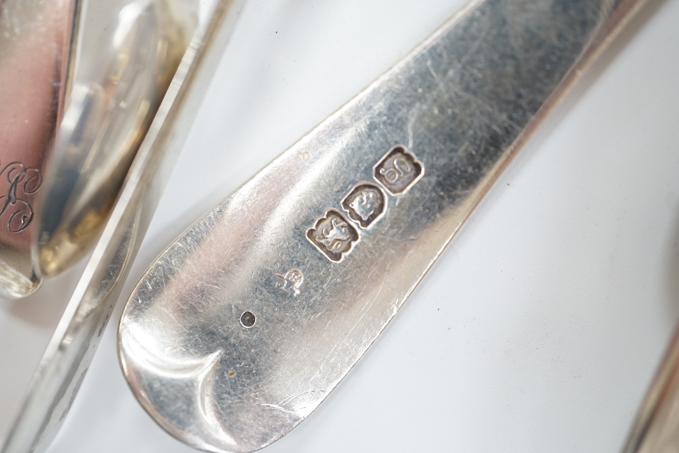 A quantity of assorted mainly 19th century silver flatware, various patterns, dates and makers, including a cased set of six 1937 Coronation silver teaspoons, four pairs of Georgian sugar tongs and a pair of Edwardian si